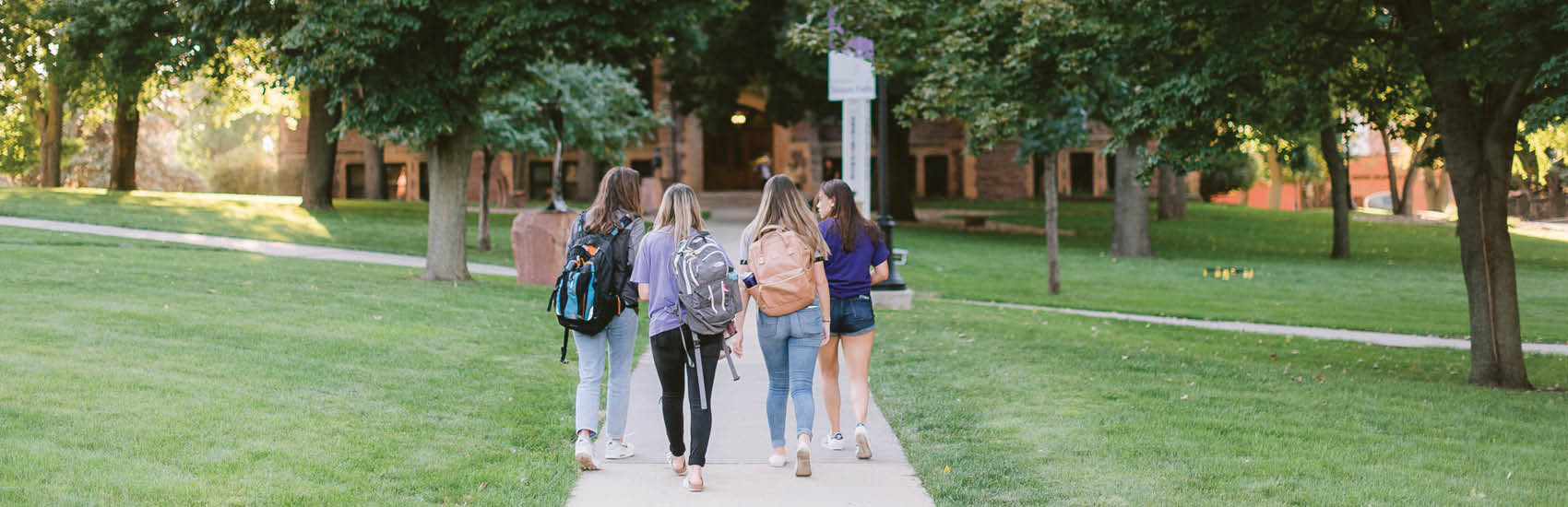 USF students walking on campus in the fall.